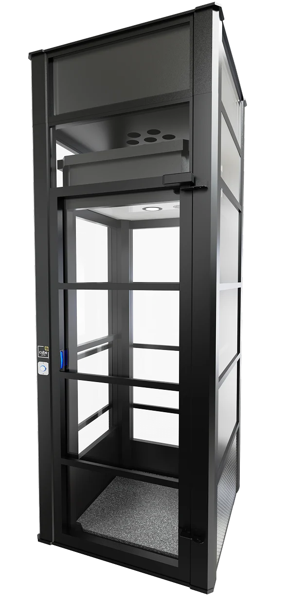 The Cube home elevator with black aluminum frame and glass panels for existing homes