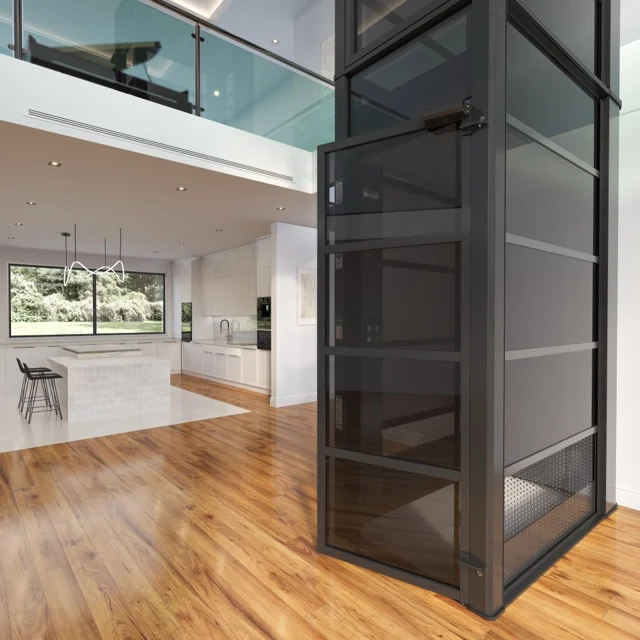 The Cube home elevator with tinted glass cab in an open plan kitchen and living area