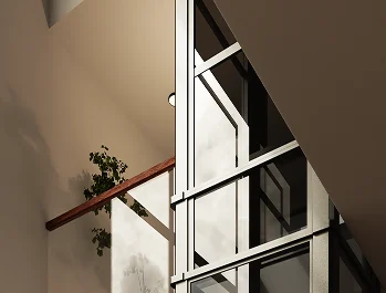 Glass tube home elevator shaft framed in metal beside a staircase landing